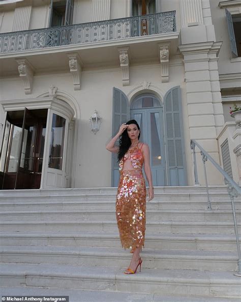 Katy Perry Poses on a Balcony in Tiny Orange Bikini